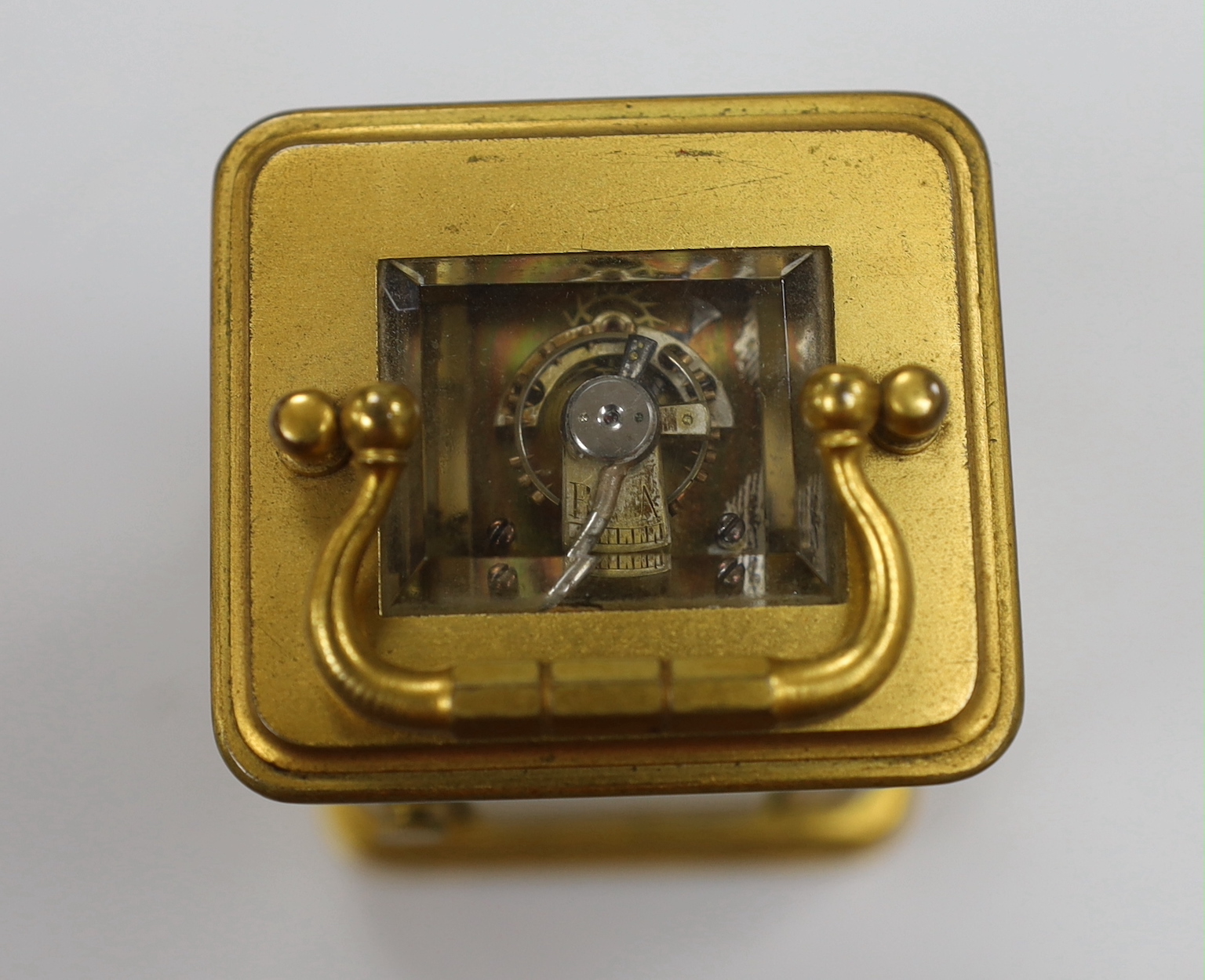 A French miniature carriage timepiece by Henri Jacot with enamel dial and leather case, 9.5cm high
